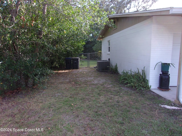 view of yard with central AC unit