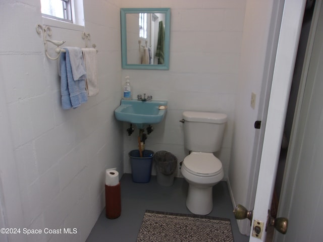 bathroom with toilet and sink