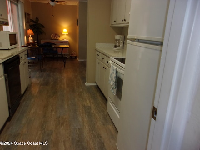 kitchen with white cabinets, ceiling fan, white appliances, and dark wood-type flooring