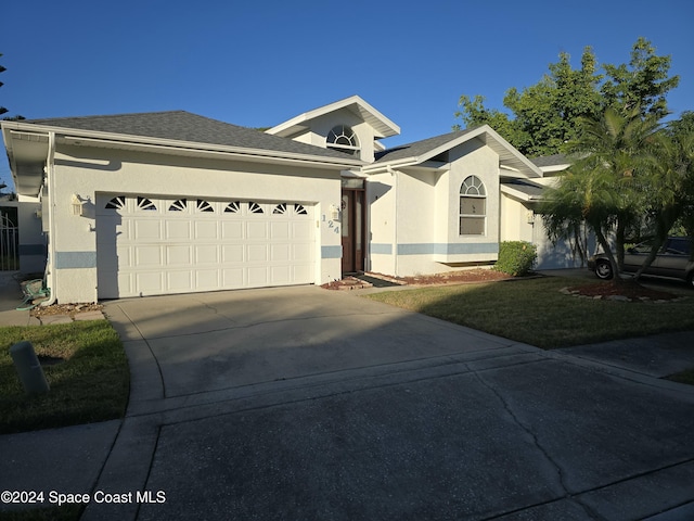 single story home with a garage