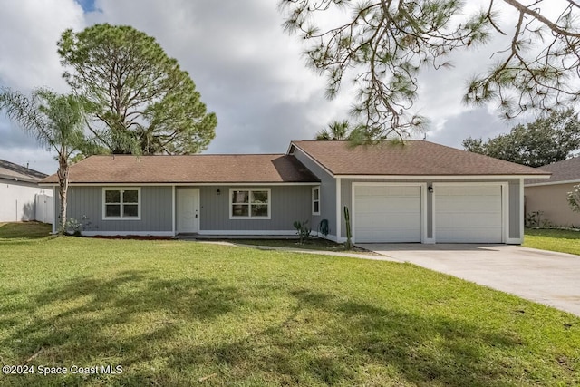 single story home featuring a garage and a front yard