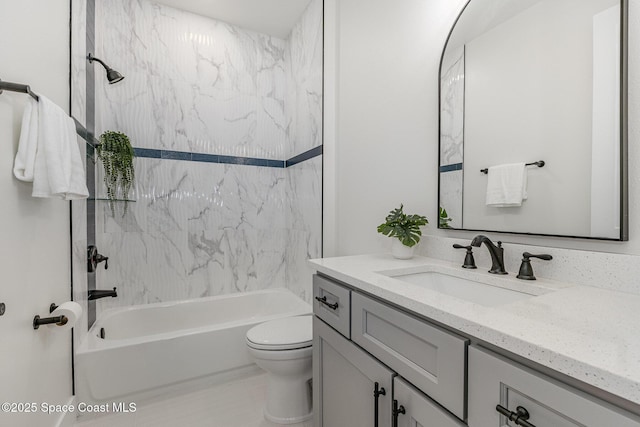 full bathroom with vanity, toilet, and tiled shower / bath combo