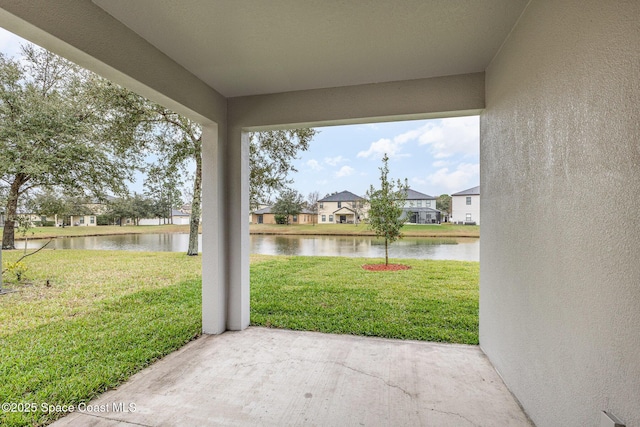 view of patio featuring a water view