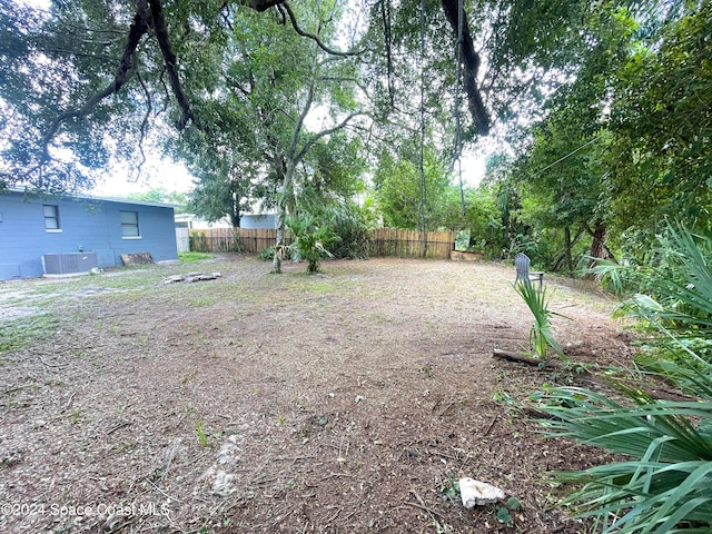 view of yard with central air condition unit