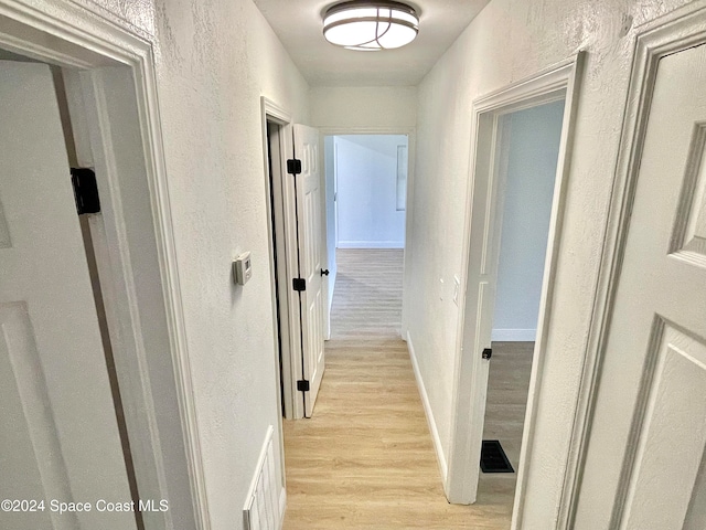 hall featuring light wood-type flooring