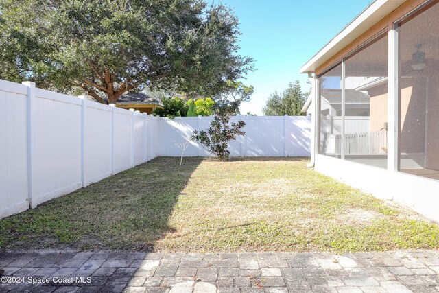 view of yard featuring a sunroom