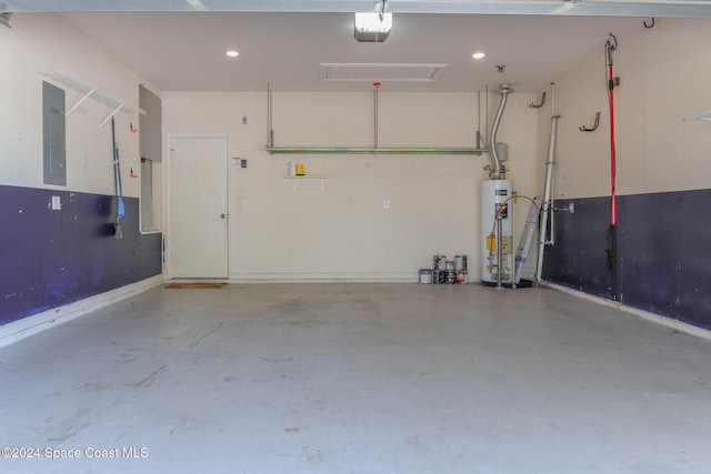 garage with electric panel, gas water heater, and a garage door opener