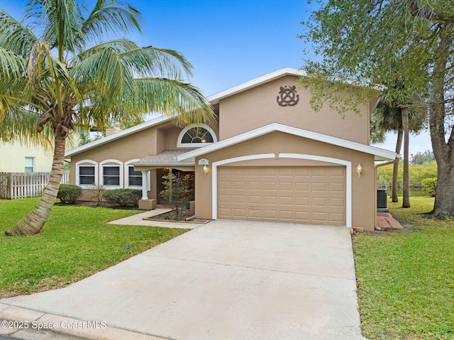 view of front of home featuring a garage and a front yard