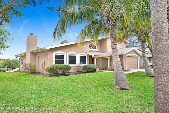 view of front of home featuring a garage and a front yard