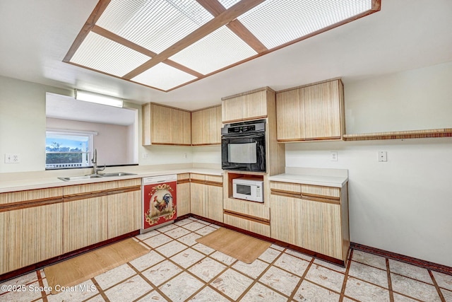 kitchen with dishwasher, sink, light brown cabinets, and oven