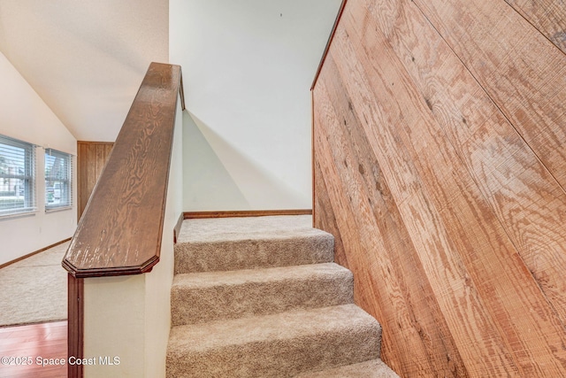 stairway with lofted ceiling