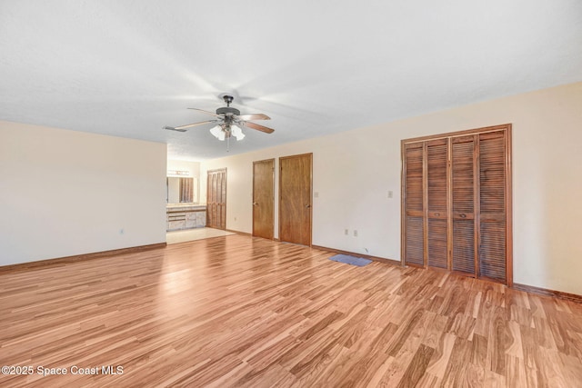 interior space featuring ceiling fan and light hardwood / wood-style flooring