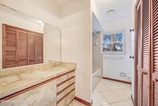 bathroom with tile patterned floors, toilet, and vanity