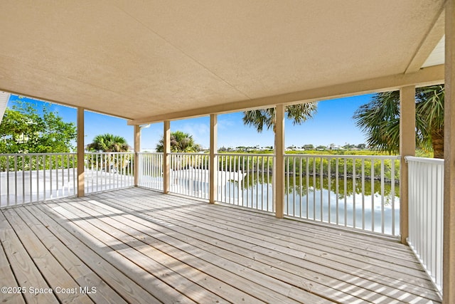 wooden deck with a water view