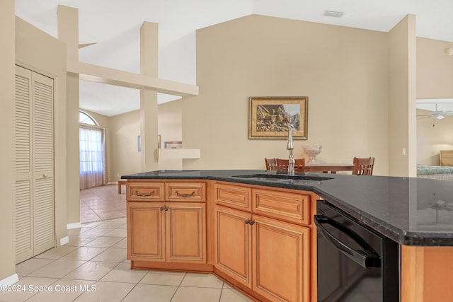 kitchen with ceiling fan, sink, light tile patterned floors, dishwasher, and lofted ceiling