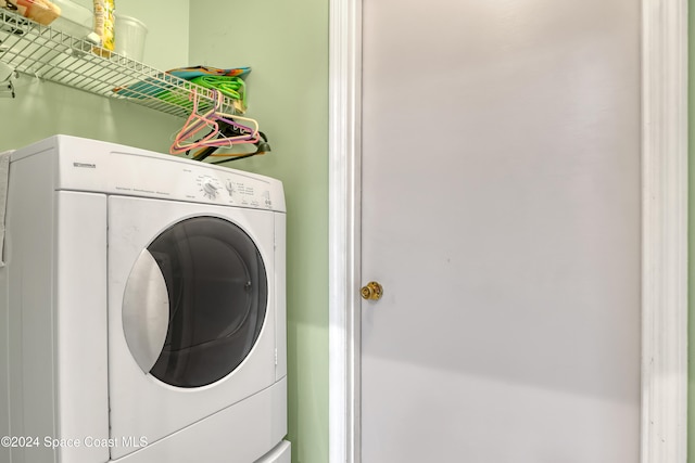 clothes washing area featuring washer / clothes dryer