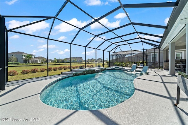 view of swimming pool featuring a lanai and a patio area