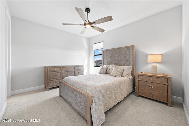 bedroom featuring light colored carpet and ceiling fan