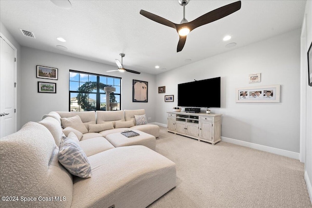 living room with light carpet and ceiling fan