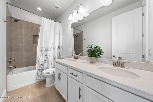 full bathroom with tile patterned floors, vanity, toilet, and shower / bathtub combination with curtain