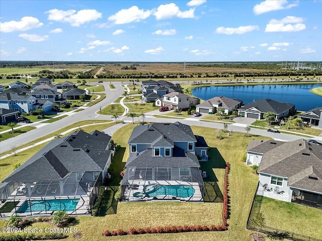 drone / aerial view with a water view