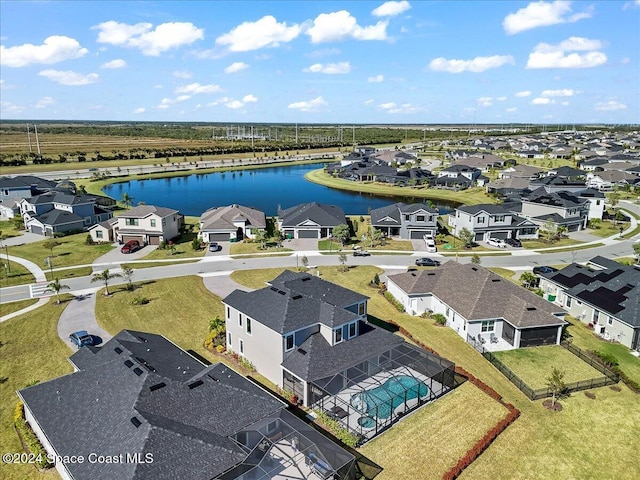 drone / aerial view with a water view