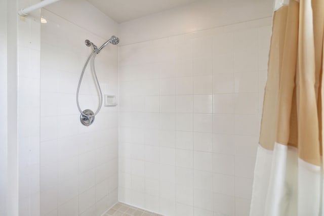 bathroom with a shower with shower curtain