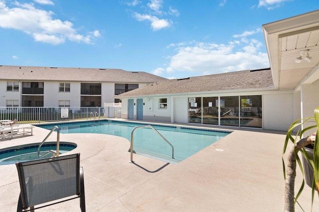 view of pool featuring a community hot tub and a patio