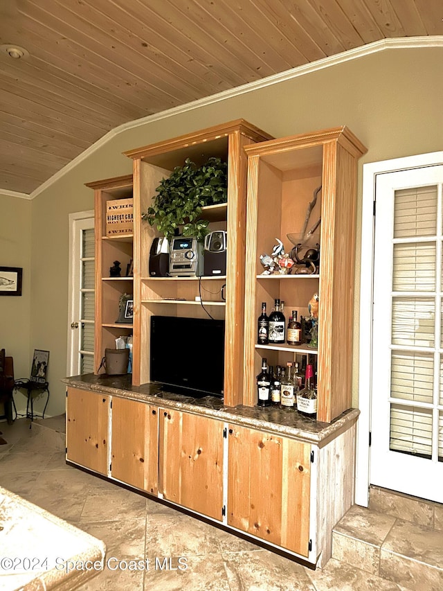 bar featuring wood ceiling, crown molding, and vaulted ceiling