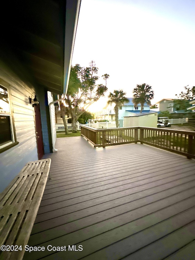 wooden deck with a water view