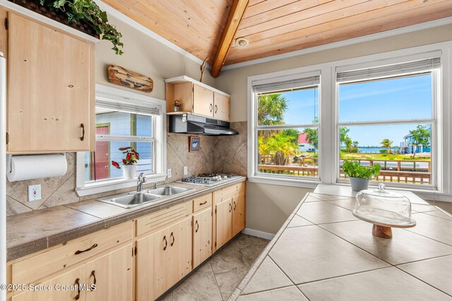 36 Vip Is Unit A, Grant, FL 32949 - kitchen featuring under cabinet range hood, wooden ceiling, light brown cabinets, decorative backsplash, and white gas cooktop