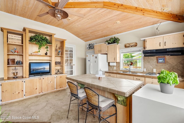 36 Vip Is Unit A, Grant, FL 32949 - kitchen featuring wooden ceiling, a sink, freestanding refrigerator, under cabinet range hood, and light brown cabinets