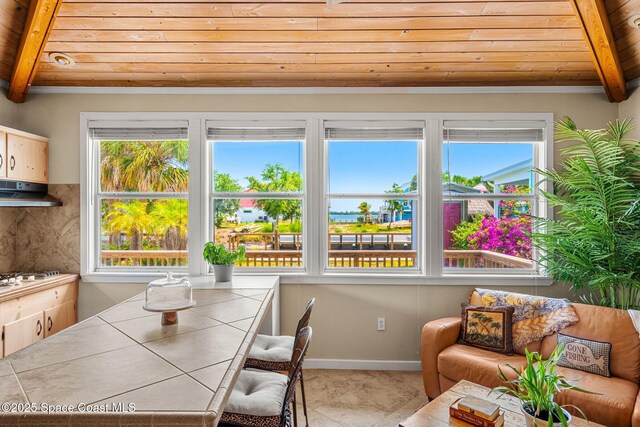 36 Vip Is Unit A, Grant, FL 32949 - dining space featuring wood ceiling and beamed ceiling