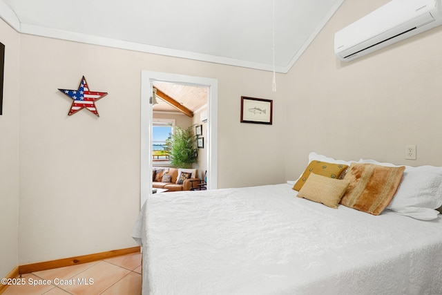 36 Vip Is Unit A, Grant, FL 32949 - bedroom featuring a wall mounted AC, attic access, vaulted ceiling, light tile patterned floors, and baseboards