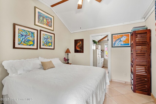 36 Vip Is Unit A, Grant, FL 32949 - bedroom with lofted ceiling, light tile patterned floors, ornamental molding, ceiling fan, and baseboards