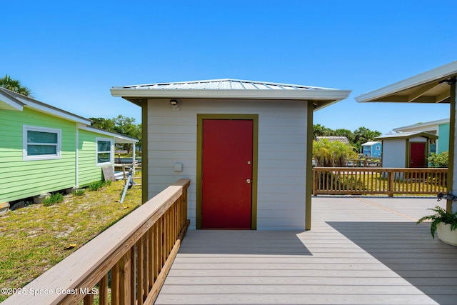 36 Vip Is Unit A, Grant, FL 32949 - wooden deck with an outbuilding and a storage shed
