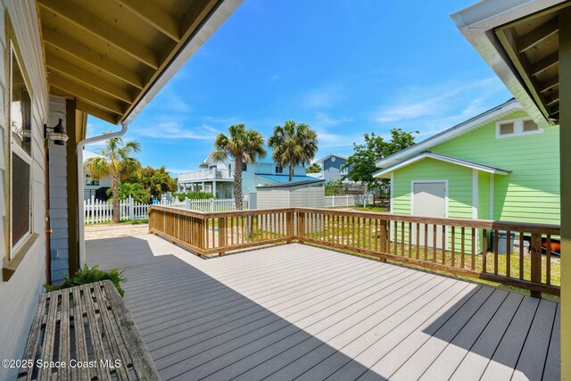 36 Vip Is Unit A, Grant, FL 32949 - deck featuring fence, an outbuilding, and a residential view