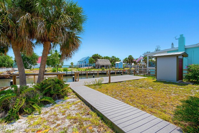 36 Vip Is Unit A, Grant, FL 32949 - view of community featuring a dock and a water view