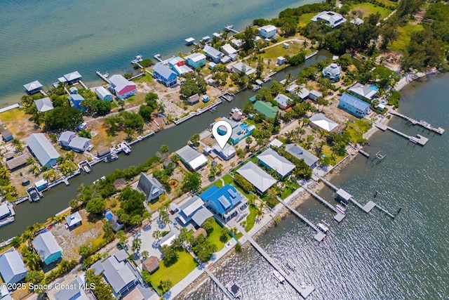 36 Vip Is Unit A, Grant, FL 32949 - aerial view of property and surrounding area with a large body of water and nearby suburban area