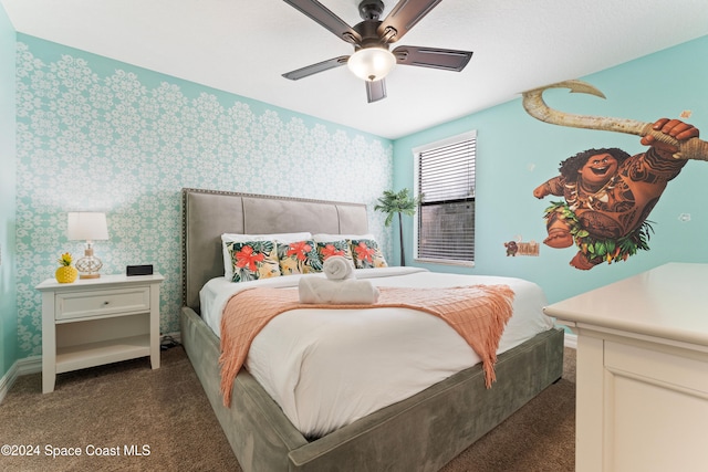 bedroom with ceiling fan and dark carpet