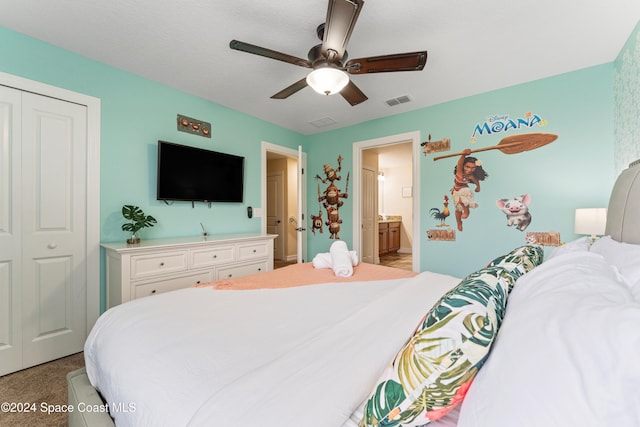 bedroom featuring light carpet, a closet, ceiling fan, and ensuite bathroom