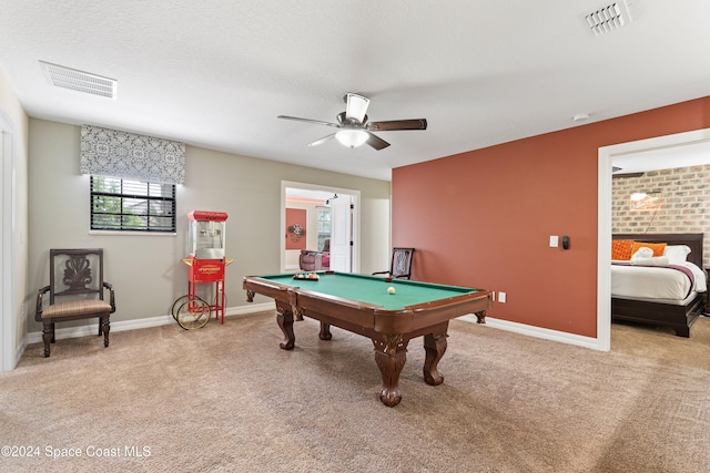 rec room with light carpet, ceiling fan, a textured ceiling, and pool table