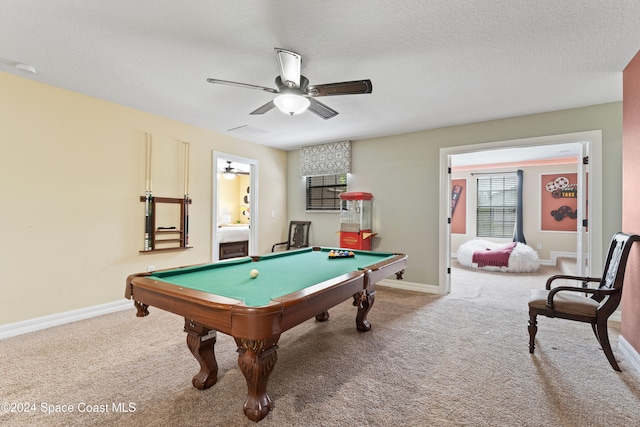 game room with carpet, a textured ceiling, ceiling fan, and pool table