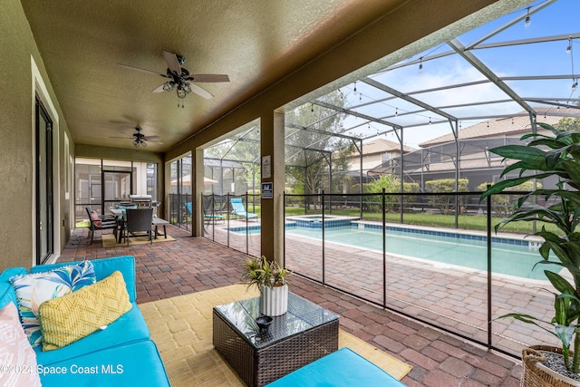 exterior space featuring a lanai, ceiling fan, and a patio