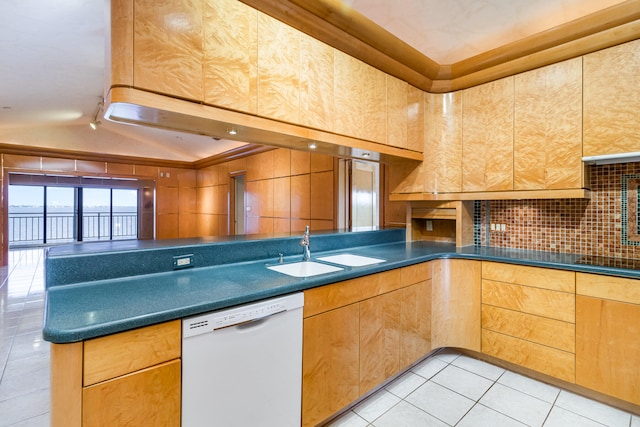 kitchen with white dishwasher, light tile patterned floors, sink, and black stovetop