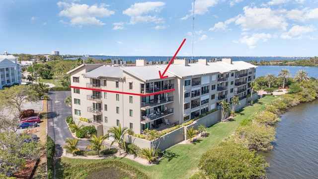 birds eye view of property featuring a water view