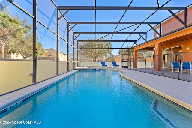 view of pool with a lanai and a patio area