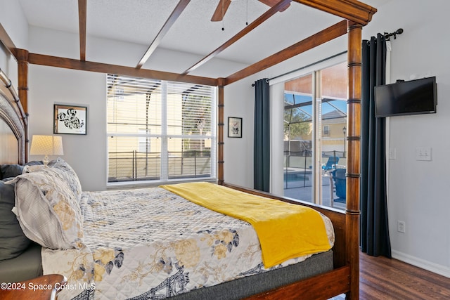 bedroom featuring hardwood / wood-style floors, ceiling fan, access to exterior, and a textured ceiling