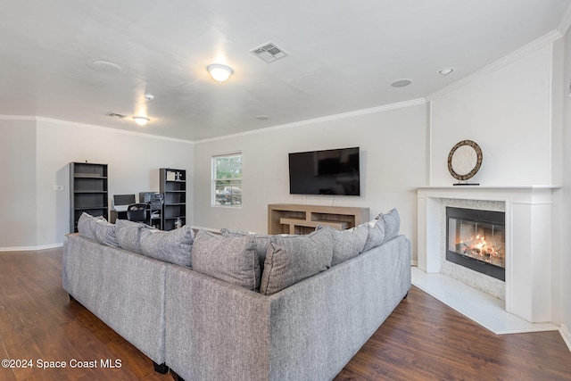 living room featuring dark hardwood / wood-style flooring and ornamental molding