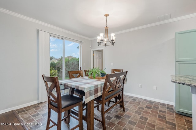 dining area featuring a chandelier and crown molding